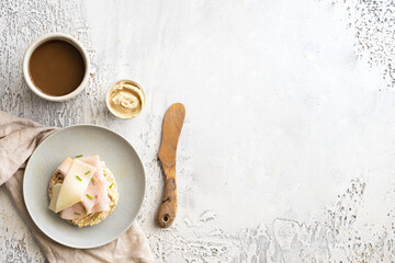 Healthy breakfast. Round buckwheat and rice cake with hummus, ham and cheese and coffee