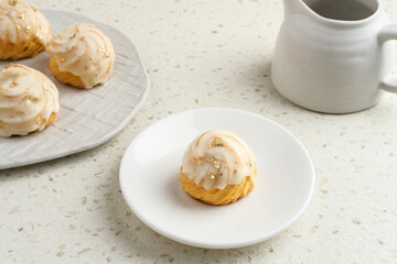 Choux pastry contains butter, water, flour, and eggs. Colorful choux with chocolate glaze.