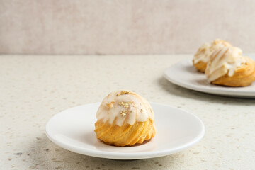 Choux pastry contains butter, water, flour, and eggs. Colorful choux with chocolate glaze.