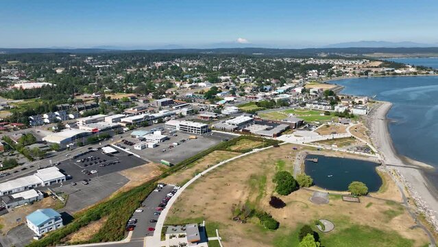 Aerial shot of Windjammer Park and old downtown in Oak Harbor, WA with Mount Baker on the horizon.