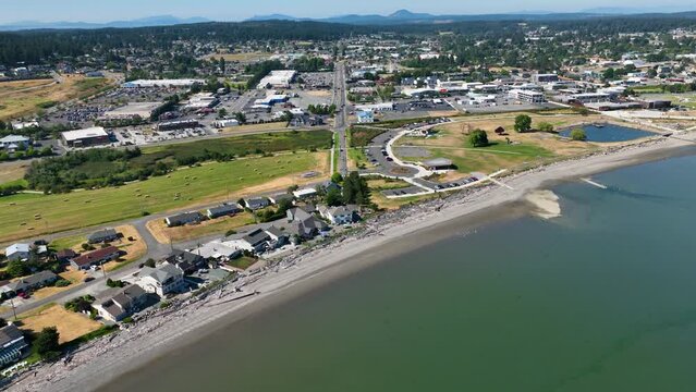Aerial shot of Oak Harbor waterfront homes and Windjammer Park protected by the safety of the harbor.