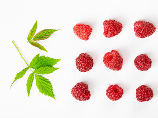 Isolated berries. Bunch of raspberry fruits with leaves isolated on white background with clipping path
