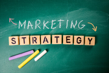 Marketing Strategy concept. Information on a green chalkboard