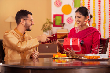 Brother giving gift to his sister on the occasion of Raksha Bandhan