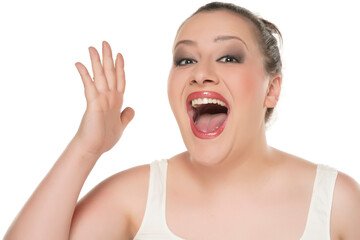 Portrait of a young happy chubby woman with makeup on a white background