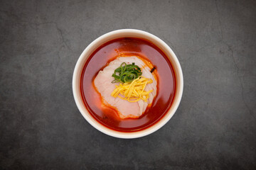 Beef soup in a white bowl.