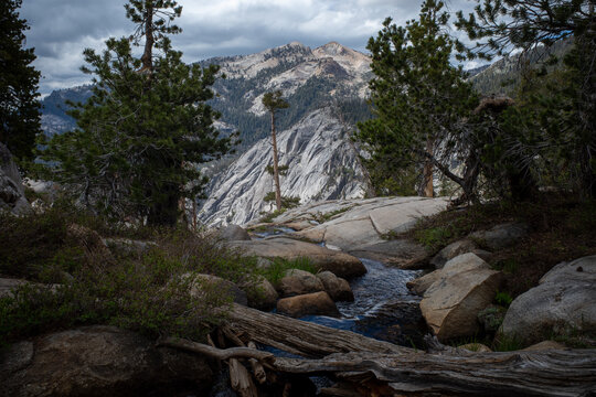 Beautiful cloudy scene of mountain stream and forest in Sequoia National Park, California