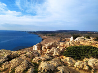 Fototapeta na wymiar Cape Greco view point near Ayia Napa. A bench on a cliff high above the sea. Travel, relaxation and tranquility concept.