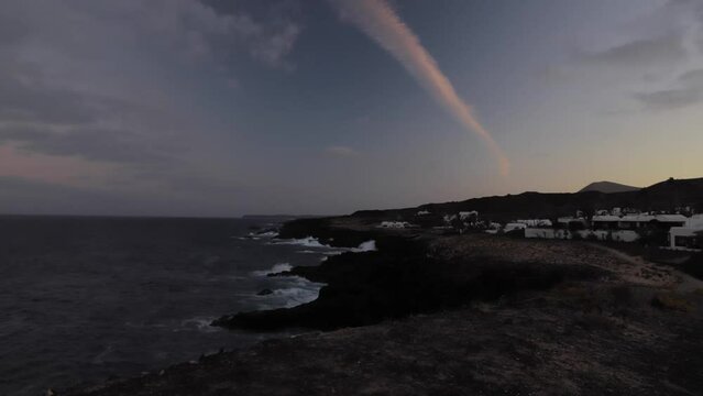 Sunset in Lanzarote during a very windy evening in Charco del Palo, Canary islands, Spain