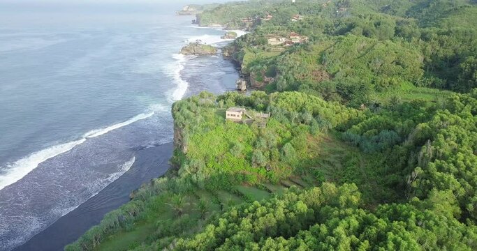 drone flight over the green  coastline of java  indonesia