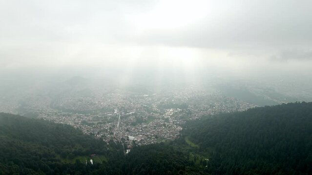 drone shot of Mexico city forest during a very polluted morning