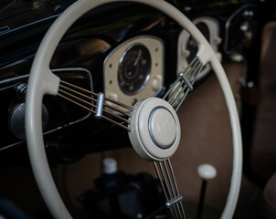 Obraz premium Dashboard and steering wheel of old-timer car
