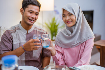 excited couple hearing adhan voices that mean iftar time or the for breaking the fast