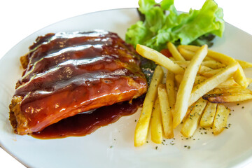 Top view of Barbecue Pork Ribs with french fries, focus selective