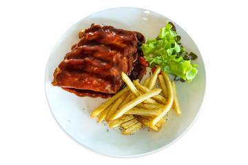 Top view of Barbecue Pork Ribs with french fries, focus selective