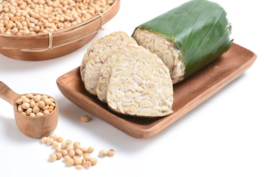 tempeh Indonesian traditional food made from fermented soybeans. They are usually wrapped in banana leaves.