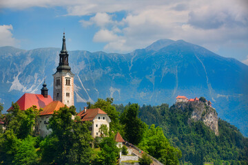 Fototapeta na wymiar The Church on Bled Island in Lake Bled, and Bled Castle, Slovenia