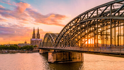Cologne Koln Germany during sunset, Cologne bridge with the cathedral. beautiful sunset at the Rhine river - obrazy, fototapety, plakaty