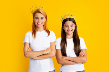 Happy woman mother and daughter child wearing crowns. Happy loving family. Mother and her daughter...