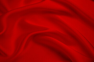 Smooth elegant red silk or satin luxury cloth texture can use as wedding background. Luxurious background design.