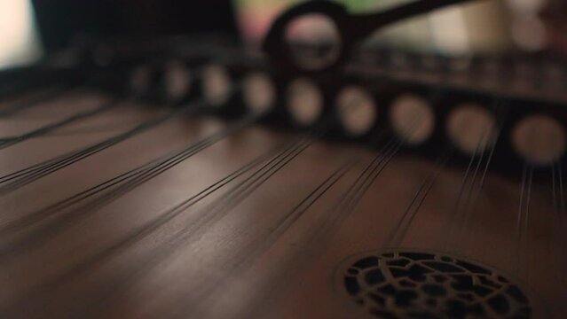 string hammering dulcimer classic music instrument, slow motion close up