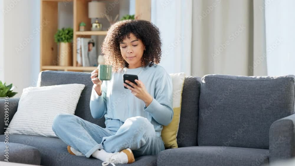 Poster Woman reading a text message on a phone, scrolling on social media online or browsing an app while drinking coffee at home. One happy, smiling and comfy black female searching the web with tea
