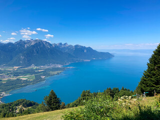 Montreux, Switzerland: 01-08-2022: Panorama of the Switzerland Alpine mountains. Ridges, peaks and lake are visible in the background. Beautiful view in the French Canton.