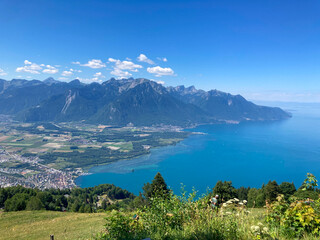 Montreux, Switzerland: 01-08-2022: Panorama of the Switzerland Alpine mountains. Ridges, peaks and lake are visible in the background. Beautiful view in the French Canton.