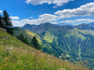 Fototapeta premium Montreux, Switzerland: 01-08-2022: Panorama of the Switzerland Alpine mountains. Ridges, peaks and lake are visible in the background. Beautiful view in the French Canton.