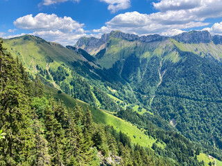 Naklejka na ściany i meble Montreux, Switzerland: 01-08-2022: Panorama of the Switzerland Alpine mountains. Ridges, peaks and lake are visible in the background. Beautiful view in the French Canton.