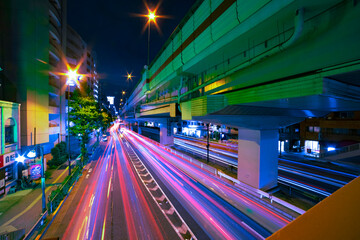 Fototapeta na wymiar A night traffic jam under the highway in Tokyo wide shot