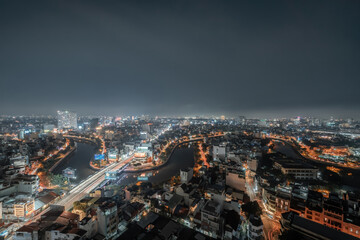 Fototapeta na wymiar Aerial view of Ho Chi Minh City, commonly known by its previous name, Saigon is the largest and most populous city in Vietnam. Travel and business concept