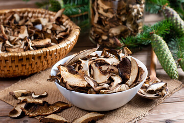 Arrangement of Forest Dried Mushrooms on Wooden table. Focus on Foreground