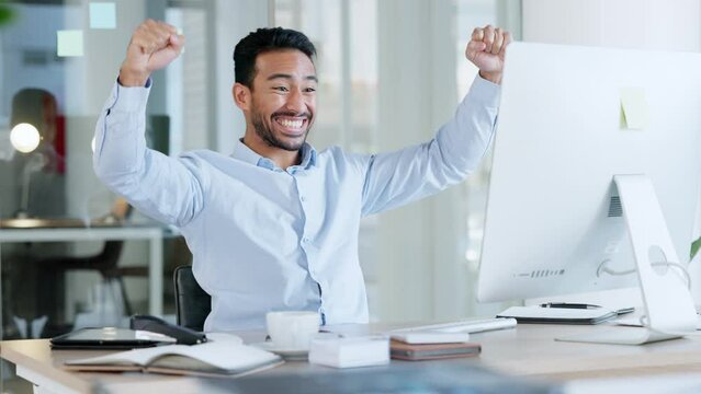 Business man celebrating and cheering for success, good news or win in online trading. Happy, cheerful and joyful corporate professional shouting in joy, looking excited and relieved after promotion