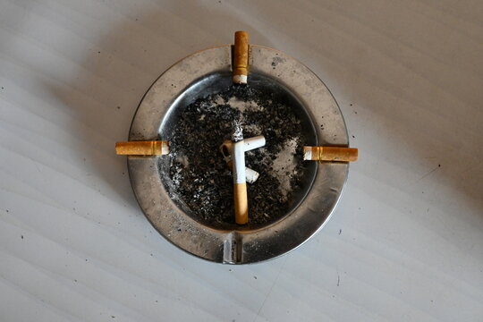 Some burnt cigarette butts in the ashtray