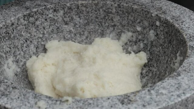 Japanese New Year's Food Tradition, Beating Rice Cakes in a Big Stone Bowl
