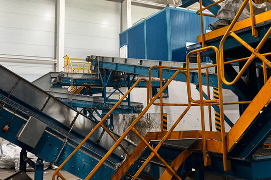 Large conveyor lines plant for sorting and processing household waste.