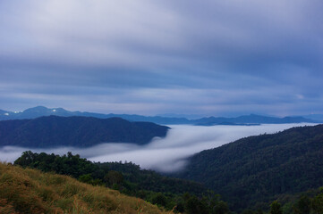 Aerial view Beautiful morning view of sunrise, golden light and mist flowing on the highland mountain, View Point. Huai Kub Kab, Chiang Mai, Thailand.