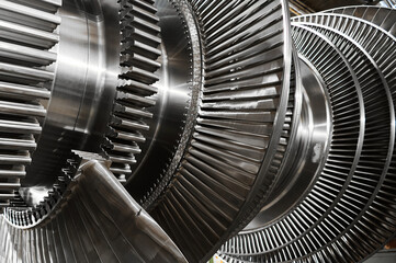 Fototapeta Shiny blades of high-speed steam turbine in workshop obraz
