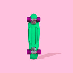 Collage art of one green skateboard on pink background with shadow in minimalism style. - 520965061