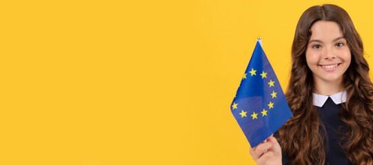 cheerful teen girl hold european union and german flag yellow background, travel. Horizontal poster...