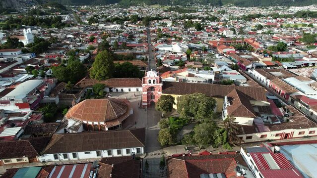 Orbital drone shot showing the Moorish style arch of the city of San Cristobal de las Casas in Chiapas Mexico