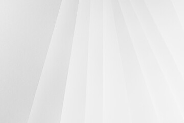 White abstract geometric background with soft light paper stripes or surfaces as radial pattern in...