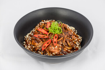 korean dish buckwheat noodles in a black plate
