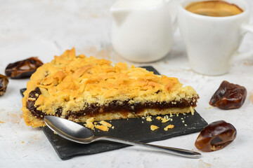 dessert apple pie on a black slate on a white background
