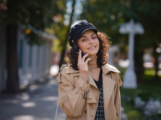 Young beautiful woman in autumn street