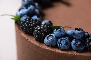 Sweet chocolate cake with forest berries