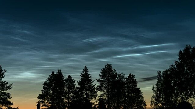 Panning video on early Sunrise over Northern Sweden. Noctilucent night clouds