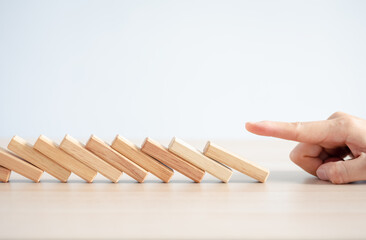 wood block row fallen by woman finger