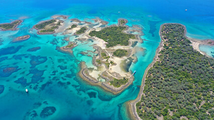 Fototapeta na wymiar Aerial drone photo of tropical exotic island complex forming a blue lagoon with crystal clear turquoise sandy beaches